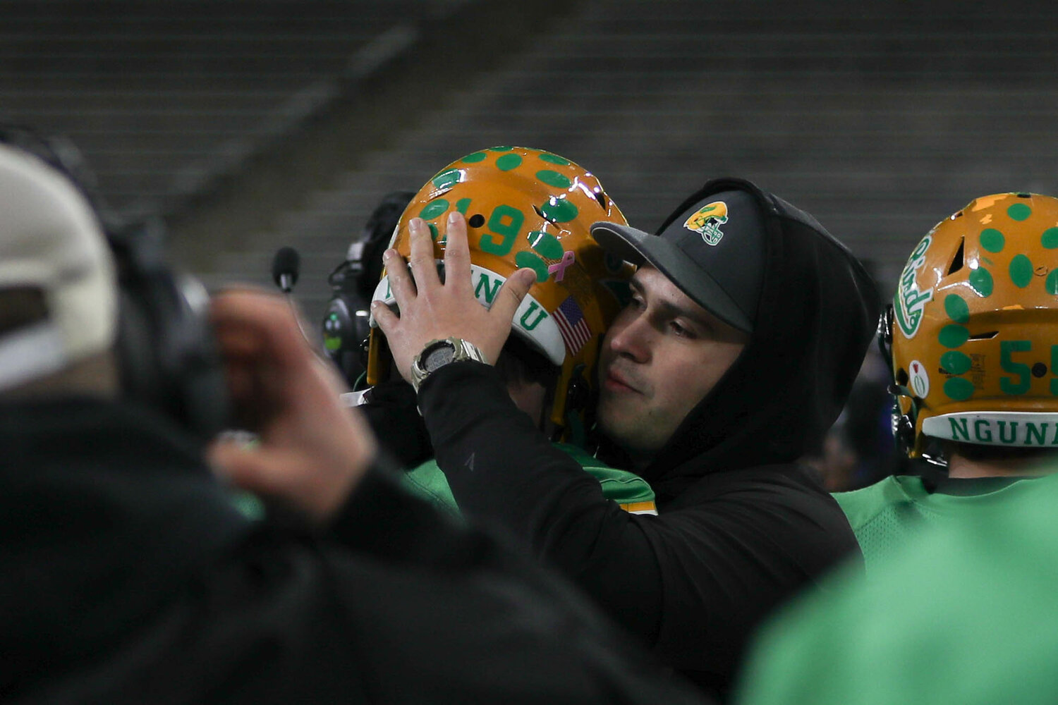 A Tumwater coach comforts a player after a 60-30 loss to Anacortes Dec. 2. at Husky Stadium.